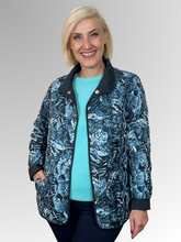 Elevate your seasonal wardrobe with the Reversible Sienna Jacket in Navy, a sophisticated two-in-one piece that adapts to your style. Crafted from easy-care nylon and polyester, this lightweight jacket features elegant embroidered detailing, practical press stud closure, and convenient pockets. Wear it one way for a polished look, then flip it for an entirely different aesthetic. Perfect for autumn and winter layering, it's the versatile essential that delivers double the style.