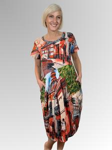 Get ready to feel cool and look amazing this summer with Orientique's Tower Bubble Dress in Peach! Made from Certified Organic Cotton and featuring a unique hand-drawn design inspired by scenery and motifs from around the world, this dress is perfect for the season. Whether you're out and about or lounging in the sun, stay comfortable and stylish all summer long.