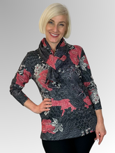 Keep cozy and chic with our Coral Long Sleeve Leaf Top. This top boasts a classic cut and is made from a warm blend of polyester and elastane. The vibrant hues and elegant print add a timeless touch to any outfit. Don't wait too long to snag a matching scarf as a bonus with purchase - only while supplies last!