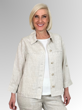 Meet the Button-Through Linen Resort Jacket in Natural, your new go-to layer for effortless, everyday style.&nbsp;Crafted from 100% pure linen, this lightweight jacket combines a relaxed, breezy silhouette with tailored details. It features a classic shirt collar and a full button-down front, making it easy to wear open over a tank or closed as a structured shirt. Designed for ultimate versatility, the sleeves come with built-in tab-and-button cuffs so you can easily roll them up on warmer days. 