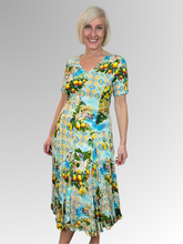 Introducing the Amalfi Godet Dress by Orientique! Made from soft, sustainable rayon, this dress features a hand painted Italian Riviera print in a gorgeous array of colours. The crinkle fabric is oh-so-comfy with no ironing required. Featuring short sleeves, a flattering V-neckline and godet panels through the skirt that create a beautiful drape and swing.&nbsp;Perfect for summer, this cool and flowy dress is a must-have addition to your wardrobe.