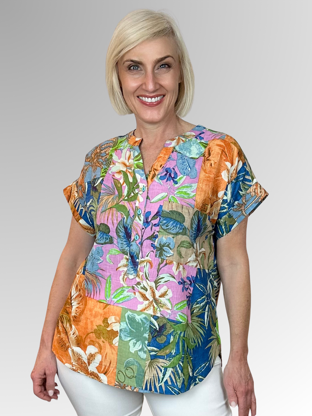 The Miramar Popover Top by Orientique is your ticket to effortless summer style. Made from Certified Organic Cotton, this lightweight piece breathes beautifully and keeps you feeling fresh all day long. The playful Nehru collar and three-button front add personality and edge to your everyday look, while the interesting floral print brings visual interest and flair. Perfect for anyone who wants to look fabulous without trying too hard.