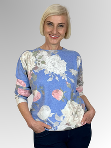 Embrace luxury and fun with our Blue Peonies Pullover. Made from a soft cotton, rayon, and cashmere blend, this pullover features fine stud trim highlights for a touch of glamour. Dress it up or wear it casually for a versatile and playful addition to your wardrobe.