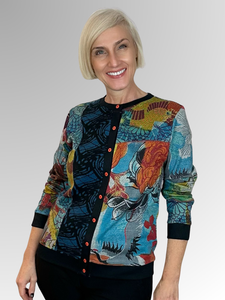 The Billie Jean Cardi Top by Orientique is a fun and modern addition to any wardrobe. Its spliced design offers versatility, allowing you to wear it open with a plain top underneath or buttoned up for a more polished look. Made with a black base colour and crafted from rayon, cotton and spandex, this top is both comfortable and stylish. A must-have for any fashion-forward individual!