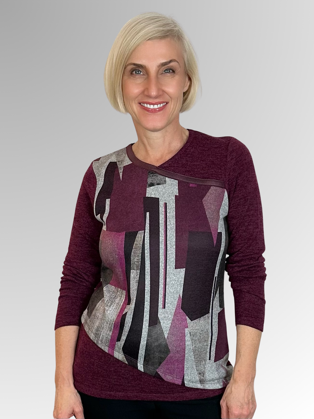 Elevate your wardrobe with the luxurious Kalisson Fallon Top, proudly made in Portugal. This statement piece blends colour, texture and comfort to create a unique and sophisticated look. Embrace confidence and style with Kalisson, known for their attention to detail and exquisite designs. Crafted from a warm polyester/elastane blend, this top boasts a chic geometric pattern and a faux trim crossover neckline. Elevate your style with Kalisson.