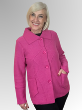Indulge in sophistication with our Boiled Wool Pink Squiggle Jacket, featuring the Woolmark emblem as a mark of excellence for Pure New Wool. This luxurious, plush design will add a touch of style to your winter wardrobe. Practical pockets keep your essentials close, while the button to the neck design allows for extra warmth. The stylish collar frames your face, and distinctive raw edge squiggle detailing adds an artistic, contemporary touch that sets this jacket apart from the ordinary.