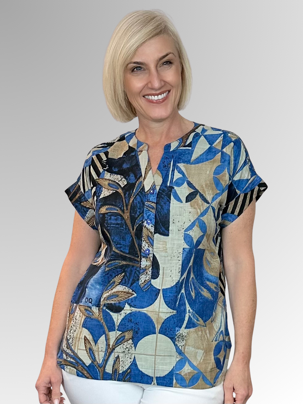 The Wyndham Popover Top by Orientique is your ticket to effortless summer style. Made from Certified Organic Cotton, this lightweight piece breathes beautifully and keeps you feeling fresh all day long. The playful Nehru collar and three-button front add personality and edge to your everyday look, while the interesting abstract print in shades of blue and natural bring visual interest and flair. Perfect for anyone who wants to look fabulous without trying too hard.