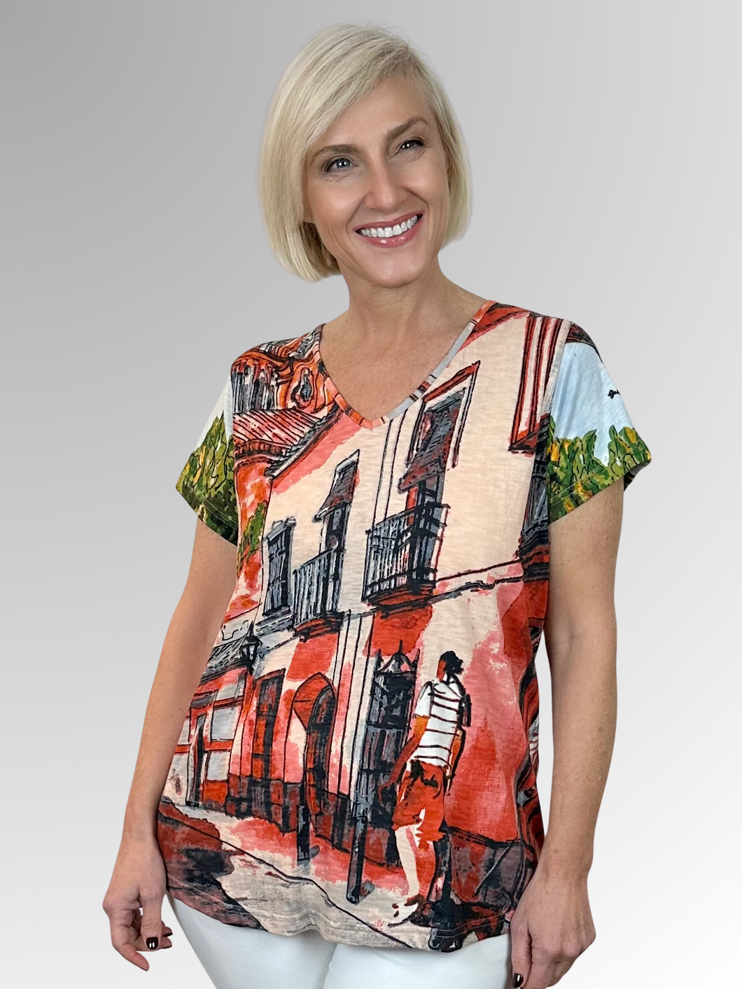 Swing into summer in this relaxed, easy to wear tee! When it comes to Orientique, expect amazing colours and comfortable designs that look modern and on trend. Crafted by Orientique's artists, the Tower Peach V-Neck Tee is made from Certified Organic Cotton and features a design inspired by scenery and motifs from around the world. Designed to fall easily over the tummy and hips, it's shaped with an A-line for a more roomy fit.