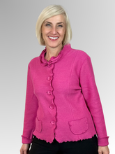Indulge in sophistication with our Boiled Wool Pink Ruffle Trim Jacket, featuring the Woolmark emblem as a mark of excellence for Pure New Wool. This luxurious and plush design will add a touch of style and warmth to your winter ensembles.