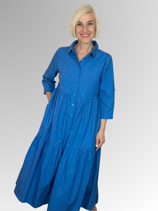 A timeless shirtdress from Orientique's Summer Essential collection crafted with 100% Organic Cotton Poplin. With a classic nautical blue hue, this piece features a button-through front, collar, and 3/4 length sleeves with fold-back tabs, for a chic, comfortable look that will stay on-trend all season long. Elevate with colourful beading for a unique finish.