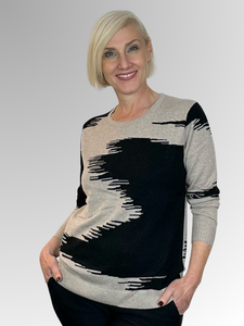 Make a statement with our Shadow Knit Pullover by Bromley. Crafted from a luxurious blend of nylon, viscose, wool, and cashmere, this pullover is lightweight and soft, providing both style and comfort. The black and stone combo adds a touch of sophistication to any outfit. Elevate your wardrobe with this stylish piece.