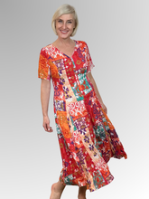 Introducing the Araya Godet Dress by Orientique! Made from soft, sustainable rayon, this dress features hand painted Persian and Oriental motifs in a gorgeous mix of jade, watermelon and peach tones. The crinkle fabric is oh-so-comfy with no ironing required. Featuring short sleeves, a flattering V-neckline and godet panels through the skirt that create a beautiful drape and swing. Perfect for summer, this cool and flowy dress is a must-have addition to your wardrobe.