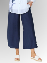 Meet your new wardrobe foundation. The Essential Button Pant in classic navy is meticulously crafted for the modern woman who refuses to sacrifice comfort for style. Whether you are running weekend errands or dressing up for a casual evening out, these pants deliver a beautifully polished look. Designed with a relaxed, wide-leg silhouette and a chic cropped length, this piece offers a breezy, fashion-forward cut that moves beautifully with you.