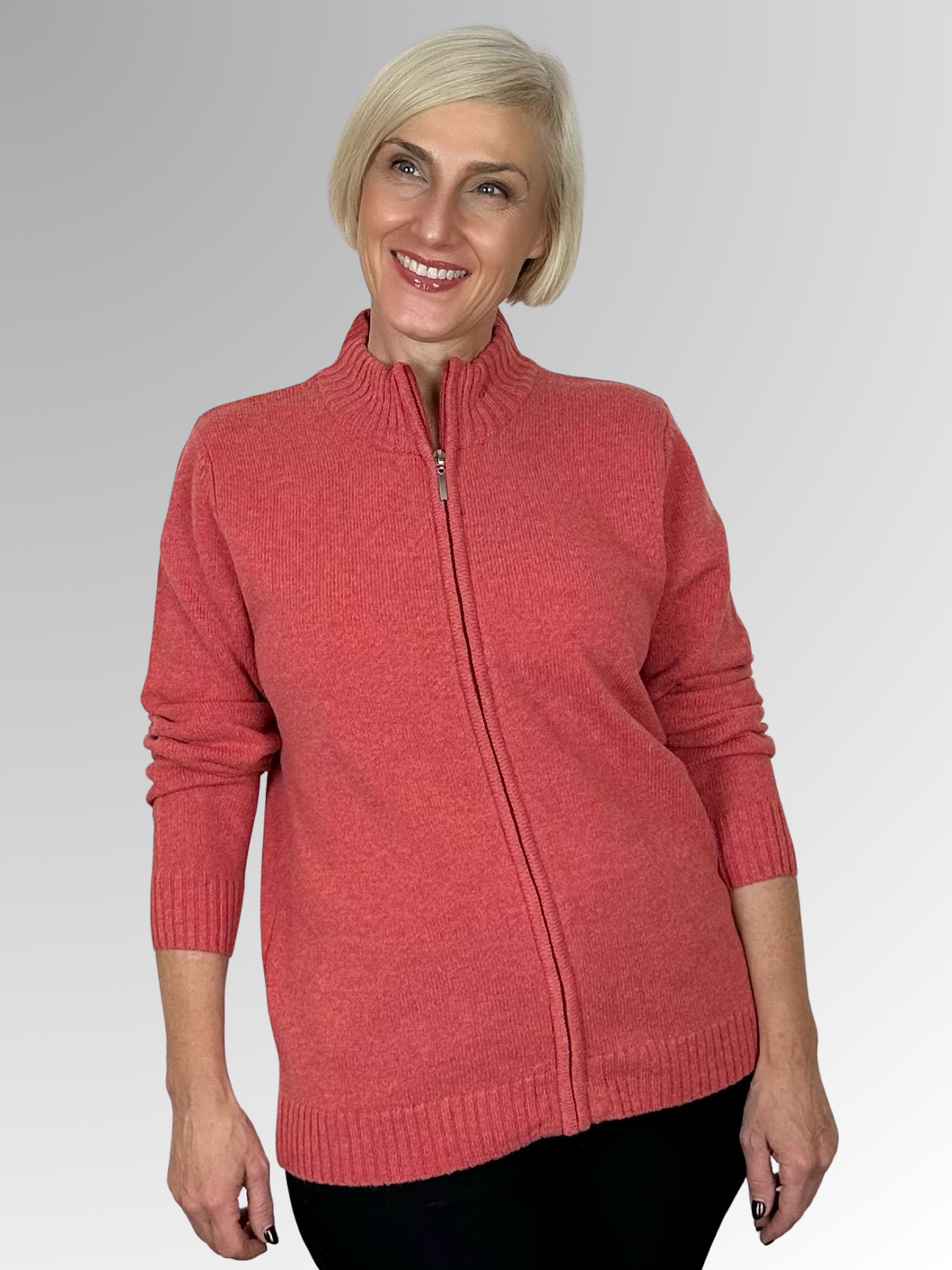 Introducing the Lambswool Paprika Zip Cardigan by Bromley, the perfect addition to any winter wardrobe. Made from 100% lambswool, this versatile piece offers both warmth and style with its stand-up neckline. Wear it zipped up as a top or open with a layer underneath for a comfortable and fashionable look. Trust in the quality of Bromley to keep you cosy all season long.