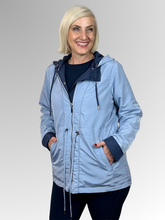 Get two looks in one with our Courtney Reversible Jacket. Flip between navy and rich blue, with contrasting cuffs that beautifully highlight the colour change. A detachable hood, practical pockets and zip-and-stud front closure give you complete control over the elements, while an adjustable drawstring waist delivers a custom fit. Made from durable polyester, this versatile jacket handles unpredictable weather with ease making it ideal for travellers and anyone who loves flexible wardrobe options.