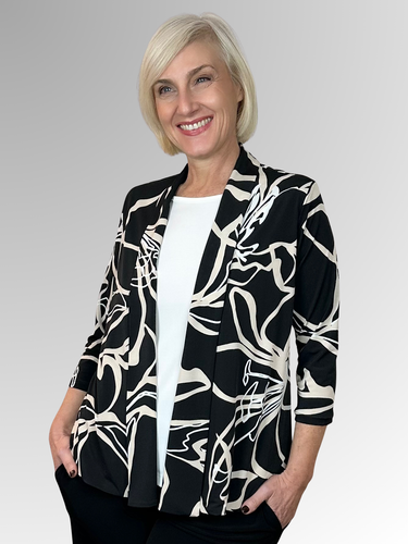 The Lotus Swing Jacket by Philosophy offers a stylish and classic look with its edge-to-edge design and relaxed swing silhouette. Featuring 3/4 length sleeves and a striking black, beige and white print, it’s perfect for any occasion. Made from a comfortable polyester-elastane blend, this jacket provides stretch and ease of movement while maintaining its shape. Enhance your wardrobe with this versatile piece that blends timeless elegance and modern comfort.