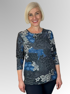 Keep cozy and chic with our Azure Long Sleeve Leaf Top. This top boasts a classic cut and is made from a warm blend of polyester and elastane. The vibrant hues and elegant print add a timeless touch to any outfit. Don't wait too long to snag a matching scarf as a bonus with purchase - only while supplies last!