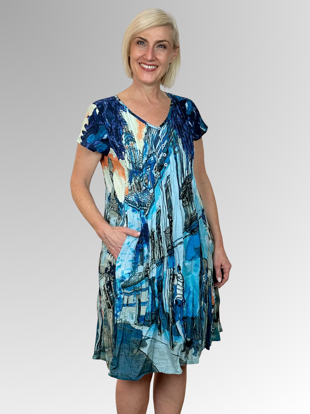 Stay cool and comfortable in the Tower Blue Easy Fit Dress by Orientique. Made from organic crinkled cotton, this dress is lightweight and perfect for those hot summer days. The relaxed fit, V-neckline with button trim and pleat detailing add a touch of style, while the pockets make it practical for everyday wear. Ideal for lounging in the heat!