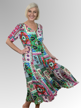 Introducing the Sao Bento Godet Dress by Orientique! Made from soft, sustainable rayon, this dress features a hand painted patchwork print in a gorgeous array of colours. The crinkle fabric is oh-so-comfy with no ironing required. Featuring short sleeves, a flattering V-neckline and godet panels through the skirt that create a beautiful drape and swing. Perfect for summer, this cool and flowy dress is a must-have addition to your wardrobe.