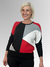 Experience elegance and timeless luxury with the Snowbound Scarlet Pullover by Alison Sheri. This meticulously crafted piece from a renowned Canadian fashion house features a soft knit blend of polyester, acrylic, nylon and wool for ultimate comfort. The striking geometric design embellished with diamanté trim adds a touch of sophistication, making every woman feel effortlessly chic.