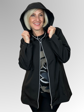 The Apex Jacket in black is your go-to layer for unpredictable weather. Crafted from durable polyester, it features a detachable hood for flexible coverage, a zip front for easy on-and-off, and practical pockets to keep essentials close. Lined with soft fleece for added warmth, it's designed to keep you warm and dry. An adjustable drawstring band cinches at the waist for a custom fit. Whether you're running errands or heading out for the day, this everyday jacket delivers reliable protection and style.