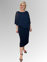 Make a statement with our Chiffon Overlay Dress in Navy. Designed for those who love timeless elegance, this piece is all about confidence and effortless style. Made in Australia from polyester/elastane, it drapes beautifully creating a flattering silhouette that enhances your natural shape. Add your favorite accessories and you're ready to own the moment.