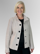 Wrap yourself in luxury with our Boiled Wool Stone Toggle Jacket. Certified with the prestigious Woolmark label, this modern, soft boiled wool jacket is both warm and stylish. Featuring toggle button detail, it's the perfect statement piece for any fashion-forward wardrobe. Upgrade your look and embrace true quality.