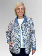 Elevate your seasonal wardrobe with the Reversible Sienna Jacket in Wedgewood, a sophisticated two-in-one piece that adapts to your style. Crafted from easy-care nylon and polyester, this lightweight jacket features elegant embroidered detailing, practical press stud closure, and convenient pockets. Wear it one way for a polished look, then flip it for an entirely different aesthetic. Perfect for autumn and winter layering, it's the versatile essential that delivers double the style.