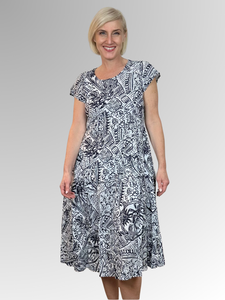 Float through summer in the Aksharay Crinkle Dress by Orientique! Crafted from easy-care organic cotton, this dress boasts a flattering bias cut and a fun navy and white print. The crinkle fabric adds a lively texture that keeps you cool when the temperature rises. Stay effortlessly chic and playful all season with Orientique!