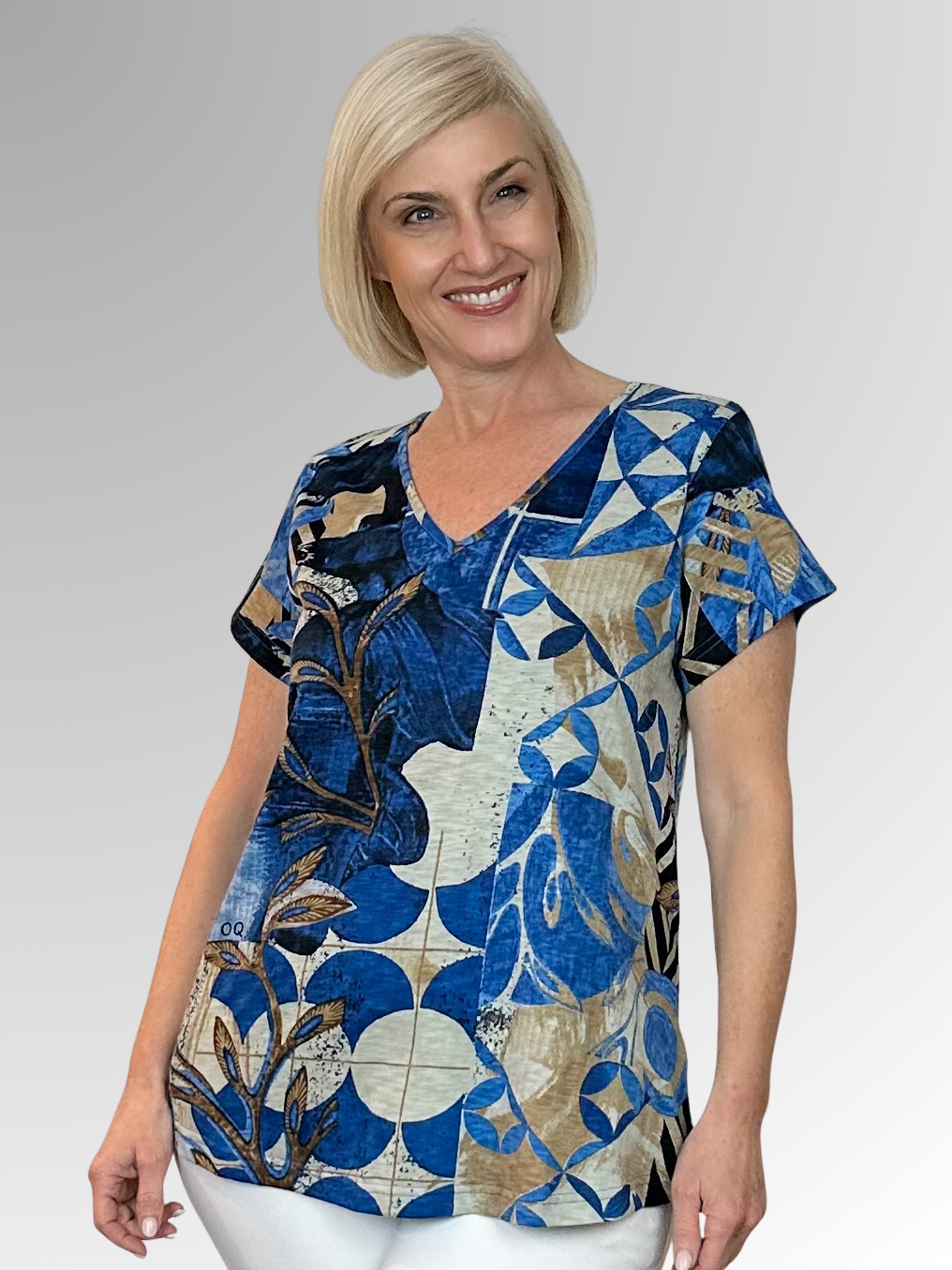 Swing into summer in this relaxed, easy to wear tee! When it comes to Orientique, expect amazing colours and comfortable designs that look modern and on trend. Crafted by Orientique's artists, the Wyndham V-Neck Tee is made from Certified Organic Cotton and features a stylish abstract design in shades of blue and natural. Designed to fall easily over the tummy and hips, it's shaped with an A-line for a more roomy fit.