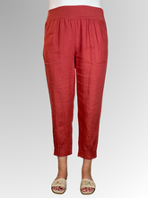 Elevate your warm-weather wardrobe with the Ankle Tuck Linen Resort Pant in Rust, the ultimate choice for effortless summer style. Perfectly balancing a trendy silhouette with everyday practicality, these pants are crafted from premium, breathable linen designed to keep you cool and comfortable all day long.