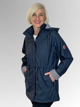 Stay dry and stylish with our Navy All Purpose Waterproof Jacket! Perfect for the changing seasons, this jacket has a detachable hood, adjustable waist for a flattering fit, and contrasting striped cuffs. Made from Polyurethane, it's fully lined and easily washable.