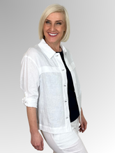Meet the Button-Through Linen Resort Jacket in White, your new go-to layer for effortless, everyday style.&nbsp;Crafted from 100% pure linen, this lightweight jacket combines a relaxed, breezy silhouette with tailored details. It features a classic shirt collar and a full button-down front, making it easy to wear open over a tank or closed as a structured shirt. Designed for ultimate versatility, the sleeves come with built-in tab-and-button cuffs so you can easily roll them up on warmer days.