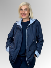 Get two looks in one with our Courtney Reversible Jacket. Flip between navy and rich blue, with contrasting cuffs that beautifully highlight the colour change. A detachable hood, practical pockets and zip-and-stud front closure give you complete control over the elements, while an adjustable drawstring waist delivers a custom fit. Made from durable polyester, this versatile jacket handles unpredictable weather with ease making it ideal for travellers and anyone who loves flexible wardrobe options.