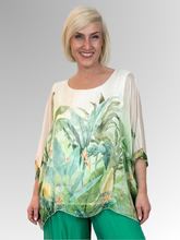 Crafted in Italy from a luxurious blend of viscose and silk, the AE Luxe Verde Serena Top embodies effortless elegance. Its feather-light construction drapes beautifully with distinctive batwing sleeves that fall to a relaxed 3/4 length, creating an understated yet striking silhouette. The soft, stretchy inner lining ensures comfort throughout the day, while the fluid fabric moves with graceful ease. Perfect for holidays and special occasions.