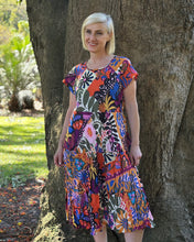 Escape the heat in style with the Salvador Crinkle Layered Pocket Dress by Orientique. This breezy number features a round neckline, short sleeves, and practical pockets to keep your essentials close. The eye-catching multi-coloured print brings instant personality to any warm-weather occasion, while the lightweight crinkle fabric keeps you cool and comfortable. Whether you're exploring a new destination or simply enjoying a leisurely afternoon, this dress delivers effortless charm. Crafted from 100% organi