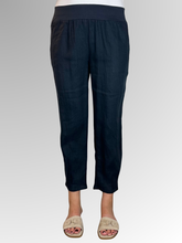Elevate your warm-weather wardrobe with the Ankle Tuck Linen Resort Pant in Navy, the ultimate choice for effortless summer style. Perfectly balancing a trendy silhouette with everyday practicality, these pants are crafted from premium, breathable linen designed to keep you cool and comfortable all day long.