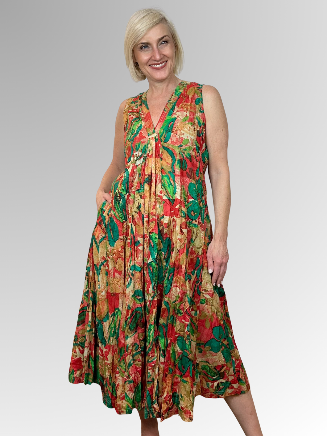 Slip into the Sao Paulo V-Neck Sleeveless Dress and embrace effortless summer style. Crafted from 100% organic cotton with a relaxed, flowing silhouette, this lightweight number keeps you feeling cool all day long. The flattering V-neckline and sleeveless cut offer comfort, while practical pockets add everyday functionality. Vibrant colours and prints bring personality to your wardrobe, making it the go-to choice for beach days, tropical escapes, and casual outings. Easy-care crinkled fabric means less fuss