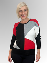 Experience elegance and timeless luxury with the Snowbound Scarlet Pullover by Alison Sheri. This meticulously crafted piece from a renowned Canadian fashion house features a soft knit blend of polyester, acrylic, nylon and wool for ultimate comfort. The striking geometric design embellished with diamanté trim adds a touch of sophistication, making every woman feel effortlessly chic.