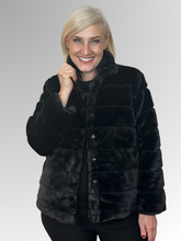 Wrap yourself in effortless sophistication with the beautifully crafted Gigi Faux Fur Jacket. Made from soft, high-quality polyester, it delivers the plush look and feel of real fur while remaining lightweight and easy to wear. In classic black, it offers timeless appeal - sleek, versatile, and endlessly easy to style.&nbsp;Featuring a structured collar and a flattering cropped silhouette, this jacket blends elegance with a modern edge. The horizontal panel detailing adds subtle texture and depth, while the