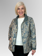 Elevate your seasonal wardrobe with the Reversible Sienna Jacket in Sage, a sophisticated two-in-one piece that adapts to your style. Crafted from easy-care nylon and polyester, this lightweight jacket features elegant embroidered detailing, practical press stud closure, and convenient pockets. Wear it one way for a polished look, then flip it for an entirely different aesthetic. Perfect for autumn and winter layering, it's the versatile essential that delivers double the style.