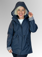 Stay dry and stylish with our Navy All Purpose Waterproof Jacket! Perfect for the changing seasons, this jacket has a detachable hood, adjustable waist for a flattering fit, and contrasting striped cuffs. Made from Polyurethane, it's fully lined and easily washable.