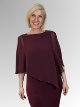 Make a statement with our Chiffon Overlay Dress in Port. Designed for those who love timeless elegance, this piece is all about confidence and effortless style. Made in Australia from polyester/elastane, it drapes beautifully creating a flattering silhouette that enhances your natural shape. Add your favorite accessories and you're ready to own the moment.