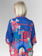 The Lula Soul Busena 3/4 Sleeve Overshirt is a standout piece for summer, showcasing a vibrant print and a timeless collar design. Detailed with intricate cutout embroidery on both the front and back, this lightweight overshirt is made from luxuriously soft viscose, ensuring comfort throughout the day. An ideal choice for elevating your warm-weather collection with a refined yet lively flair.