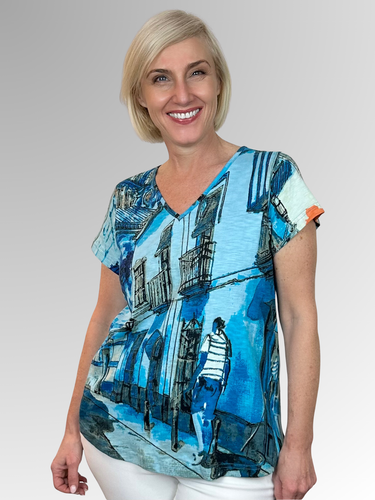 Swing into summer in this relaxed, easy to wear tee! When it comes to Orientique, expect amazing colours and comfortable designs that look modern and on trend. Crafted by Orientique's artists, the Tower Blue V-Neck Tee is made from Certified Organic Cotton and features a design inspired by scenery and motifs from around the world. Designed to fall easily over the tummy and hips, it's shaped with an A-line for a more roomy fit.