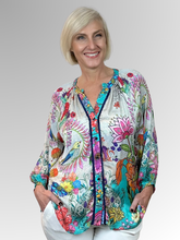 The Lesante 3/4 Sleeve Overshirt by Lula Soul offers a pretty and feminine style with its flouncy silhouette and delicate floral print featuring birds. Crafted from silky viscose, it feels smooth against the skin and is perfect worn open over a coordinating camisole for a playful, breezy look.