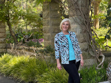 Experience the carefree comfort of our Amazon 3/4 Sleeve Zip Jacket, with its relaxed silhouette and effortless style. Featuring an abstract leaf design in mint, beige, black and white tones, this jacket effortlessly complements any of our camis. Made in Australia from Poly/Spandex, this jacket is machine-washable and quick-drying for your convenience.