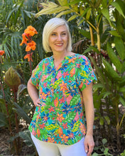 The Fortaleza Popover Top by Orientique is your ticket to effortless summer style. Made from Certified Organic Cotton, this lightweight piece breathes beautifully and keeps you feeling fresh all day long. The playful Nehru collar and three-button front add personality and edge to your everyday look, while the interesting floral print brings visual interest and flair. Perfect for anyone who wants to look fabulous without trying too hard.