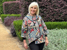 Experience the ultimate sophistication with our Wishstone Tapestry Swing Jacket. Made from cotton, this jacket is not only luxurious, but it also makes a statement. The asymmetric hemline provides a unique touch, while the 3/4 length sleeves and striking overlapping collar add an elegant flair. Finished with black piping, this jacket coordinates with a variety of colours, making it a versatile addition to any wardrobe. Perfect for covering the bottom, elevate your style with this exclusive piece.
