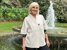 Crafted from Woolmark certified wool, the Boiled Wool Cape in cream combines timeless elegance with contemporary design. The relaxed oversized fit is intentionally loose, perfect for layering and creating effortless, modern silhouettes. Functional pockets add practicality to the stylish single-button closure. Versatile and sophisticated, it's designed to elevate any wardrobe with understated luxury.